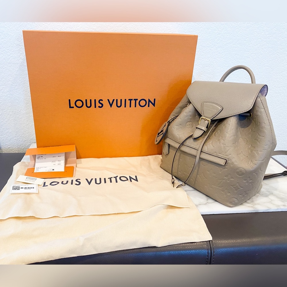 Authentic Louis Vuitton Montsouris PM Backpack In Empreinte Turtledove.